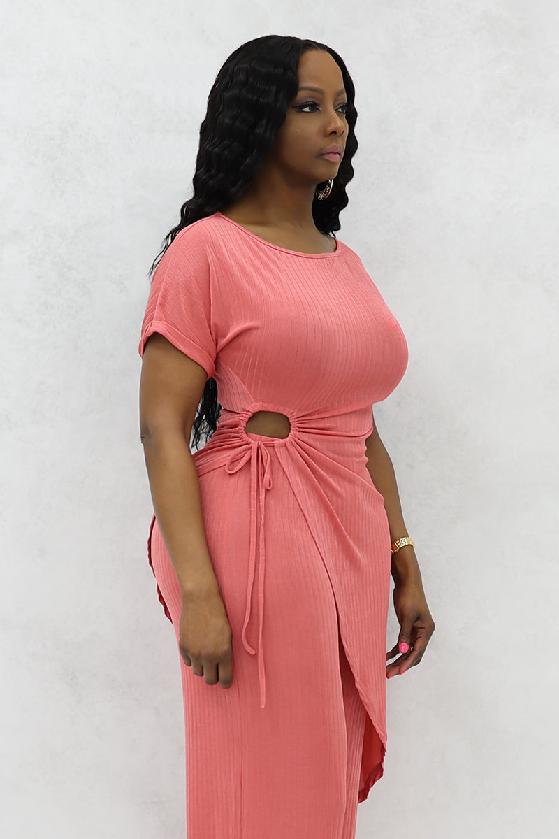 A woman wearing Mauve asymmetrical half sleeves long top with a modern, flowing design with matching pants.