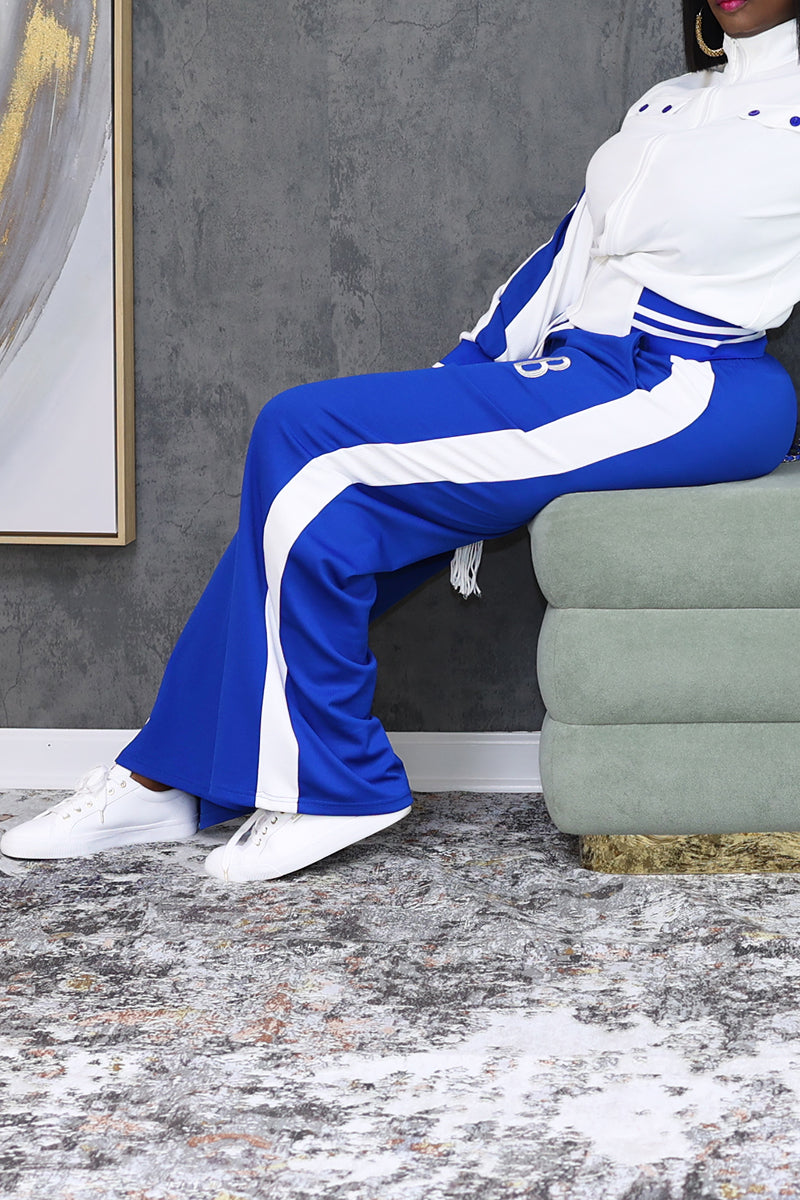 A woman wearing White and blue B-Girl sweatpants featuring a casual, sporty design.