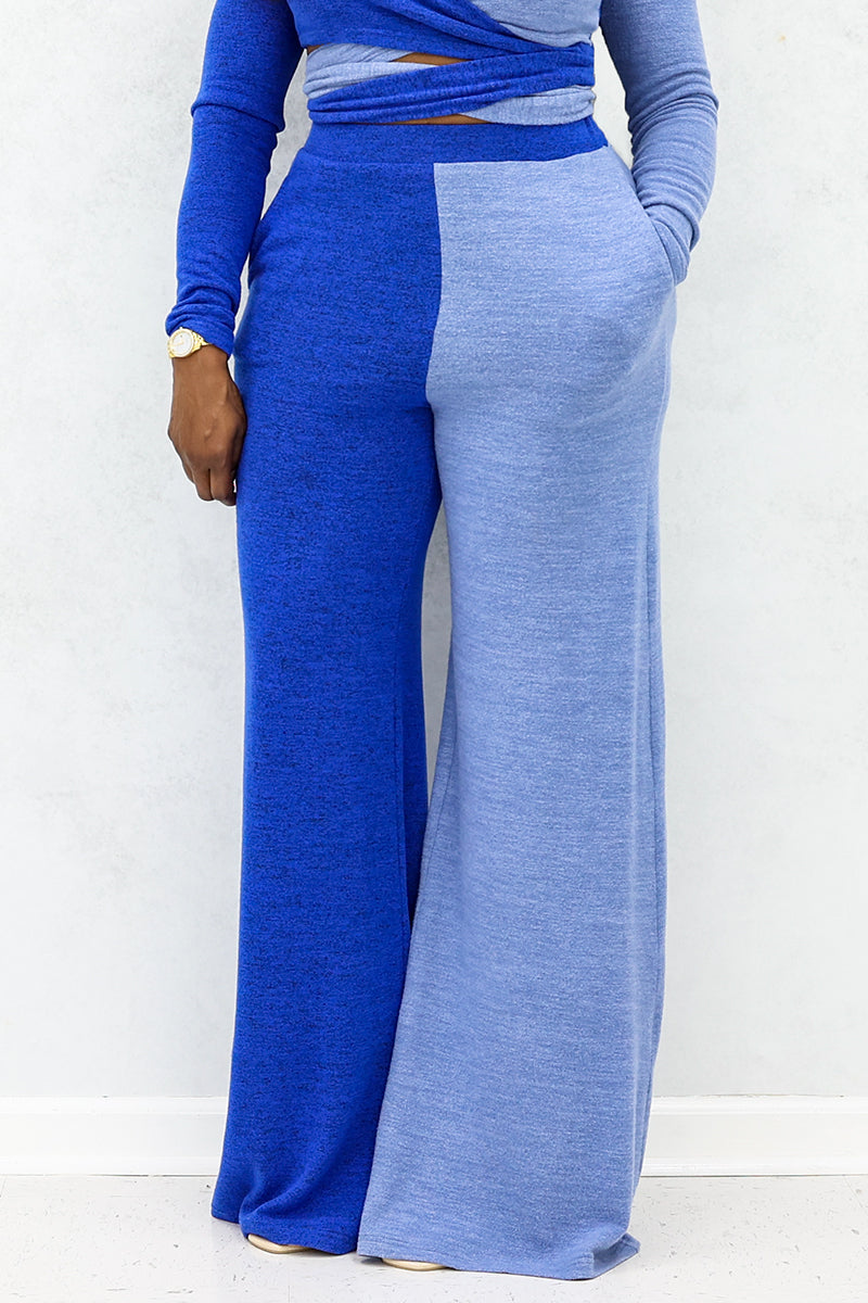 A woman wearing Blue wide-leg pants with sky blue side panels for a trendy style.
