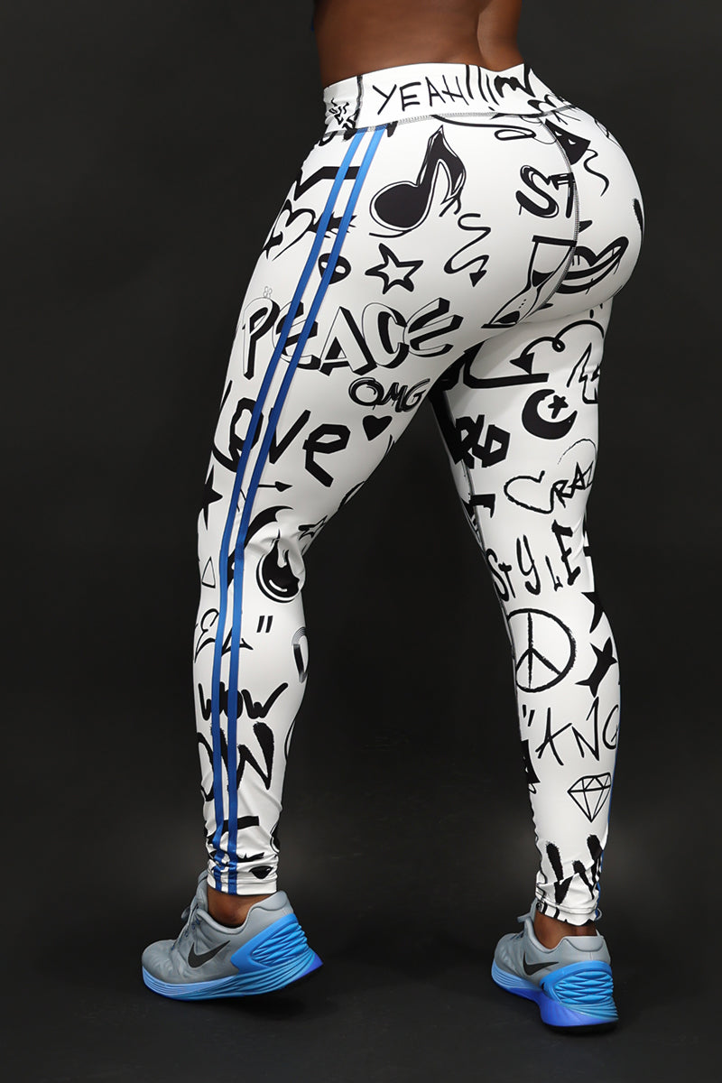 A woman wearing Black and white tights with a street-style design.