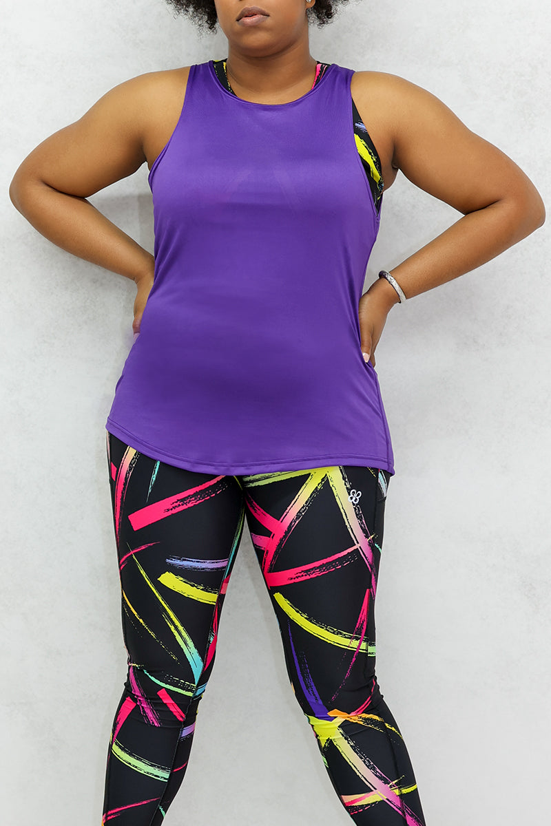 A woman wearing Purple training tank top designed for comfort and performance.