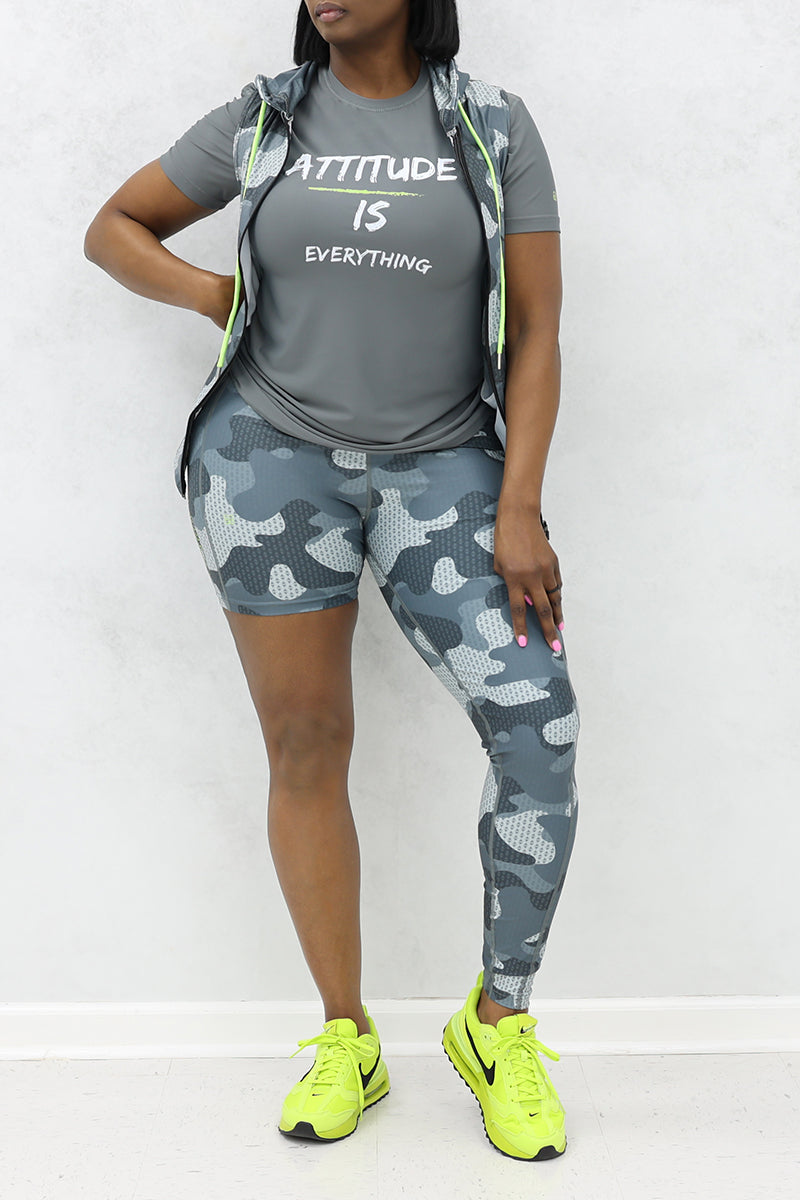 A woman wearing Grey t-shirt with 'Attitude Is Everything' slogan for a casual and trendy style.