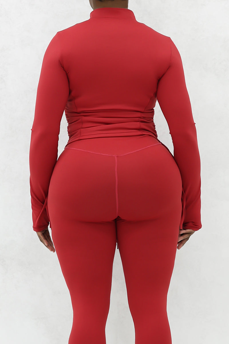 A beautiful woman wearing a red cherry Flex jacket.