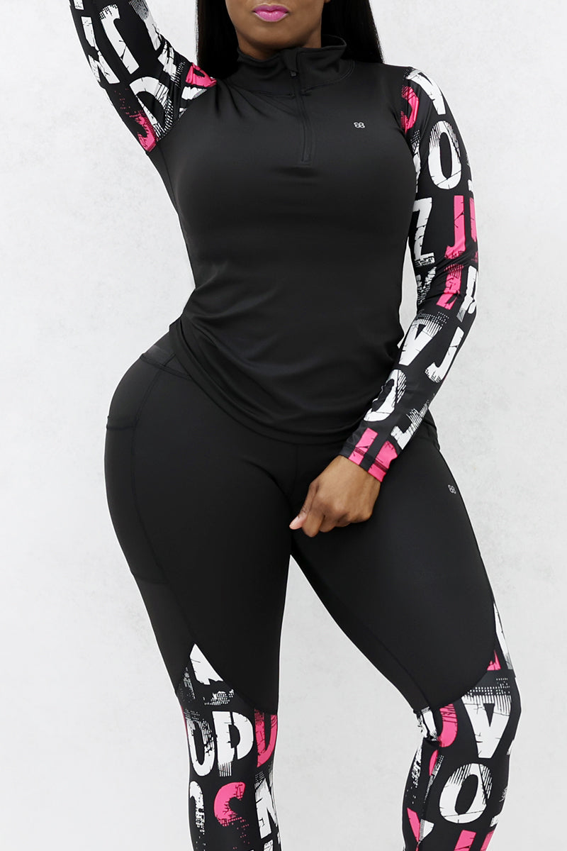 A woman wearing a pink and black School Half-Zip Pullover featuring a stretchy design, side pockets, and a half zipper, perfect for a stylish yet comfortable look.