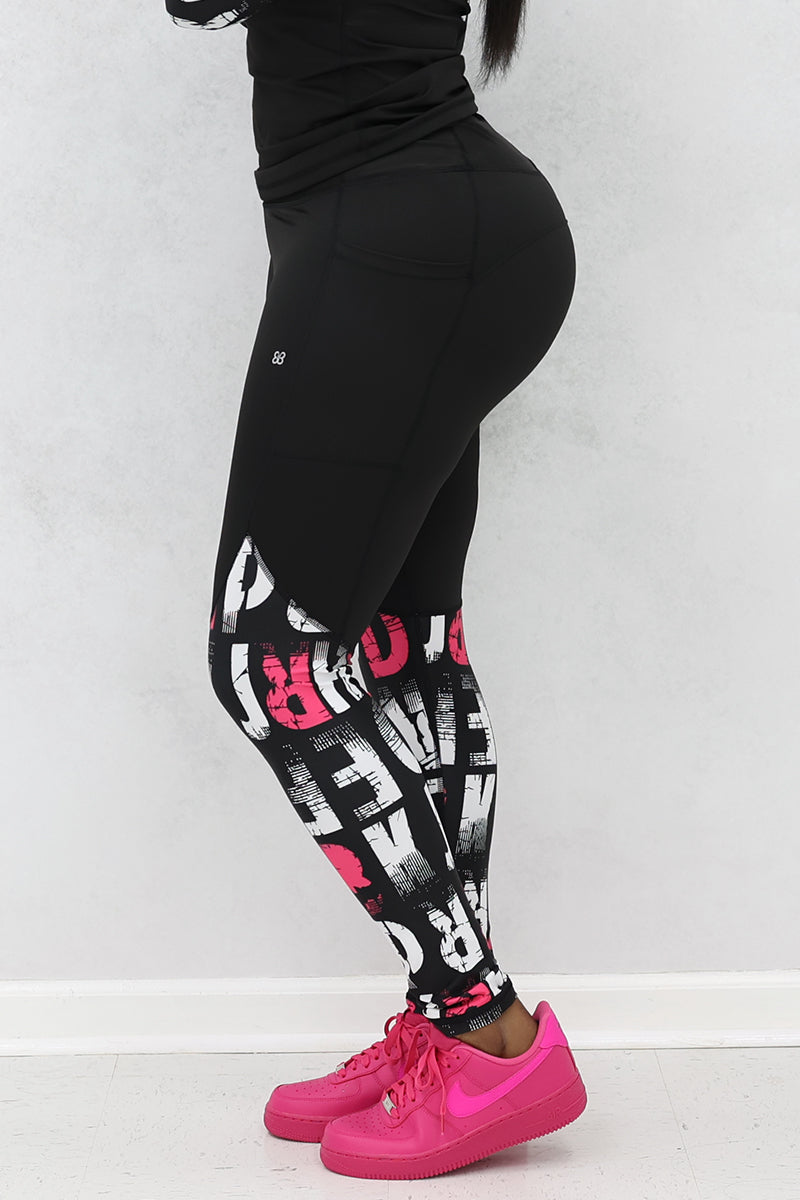 A woman wearing pink and black School Tights made from stretchy polyester and spandex, featuring a continuous drawstring for a secure fit, perfect for a trendy and comfortable look.