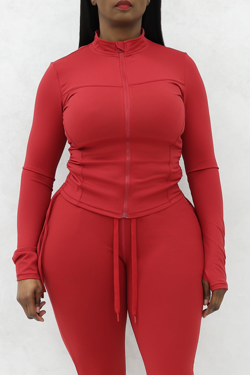 A beautiful woman wearing a red cherry Flex jacket.