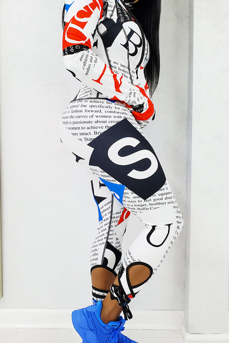 Black woman wearing blue sneakers and fitness strappy capris.