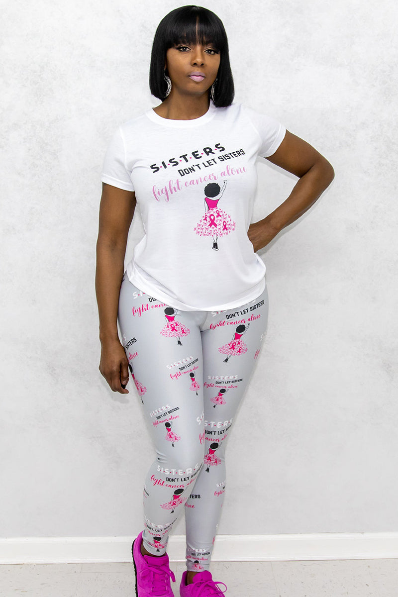 A woman wearing Sisters Don't Let Sisters Tights in silver, featuring a stylish design that promotes Breast Cancer awareness while providing comfort for various activities.