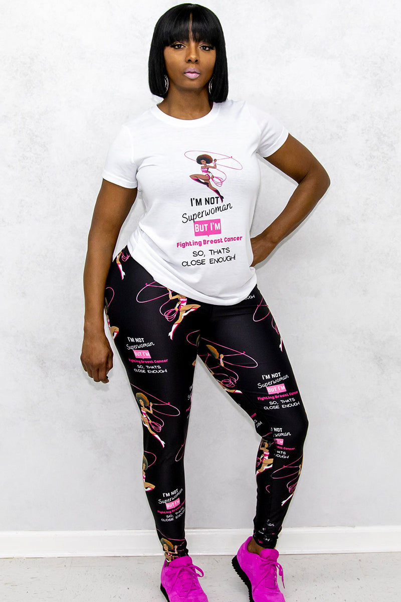 A woman wearing white t-shirt and black tights with Breast Cancer Awareness prints and pink shoes.