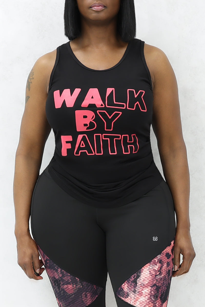 A woman wearing black tank top with pink color "Walk by Faith" text on it and black-pink tights.