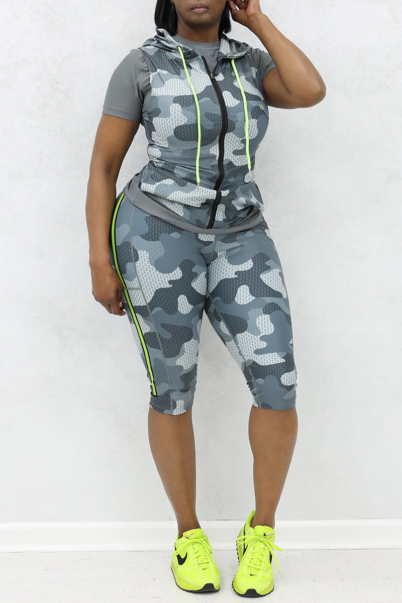 A woman wearing Grey and black camo sleeveless jacket with a stylish, casual look.