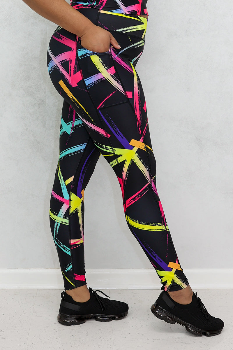 A beautiful woman wearing multi-colored Flashing Lights tights.