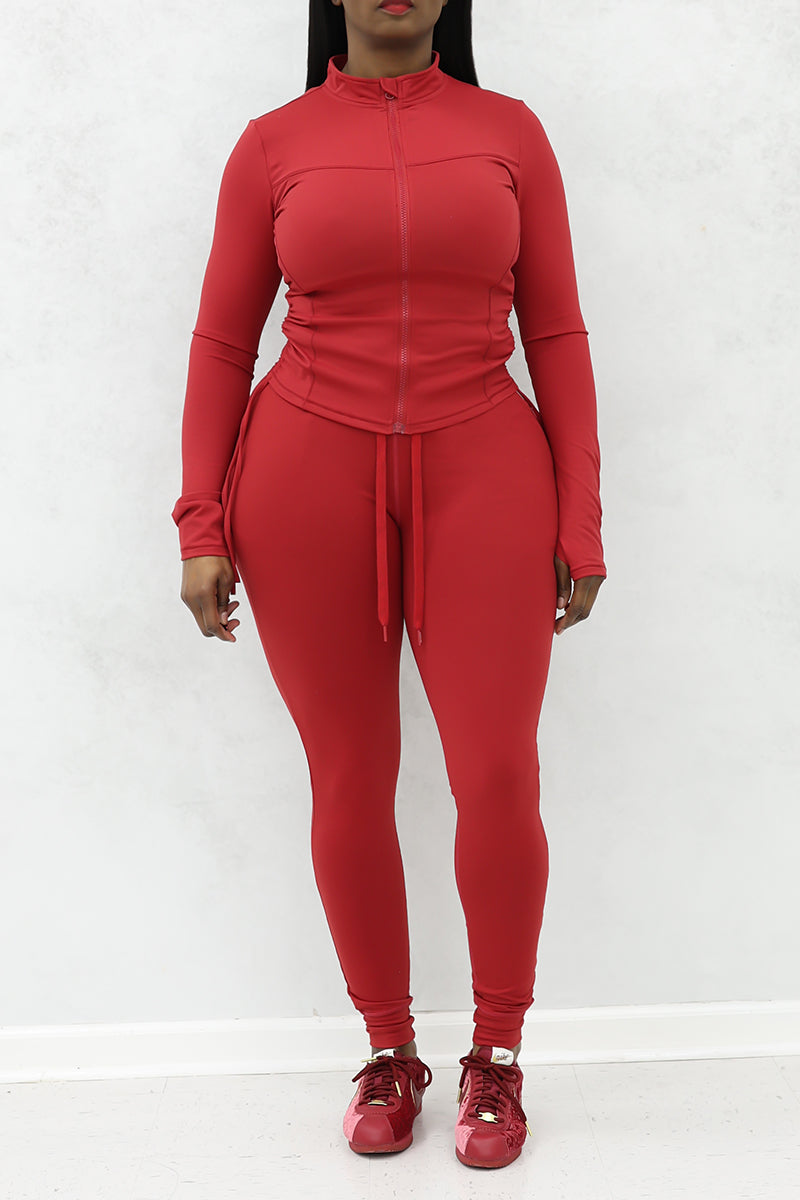 A beautiful woman wearing red cherry Flex fitted joggers.