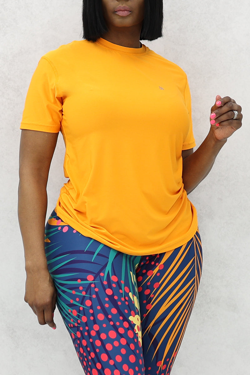 A beautiful woman wearing an orange EVAP relax fit t-shirt.