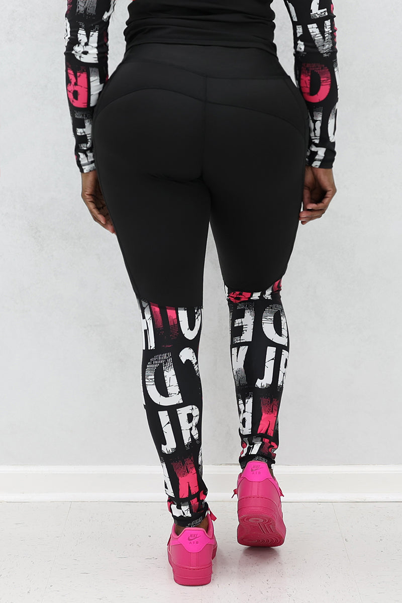 A woman wearing pink and black School Tights made from stretchy polyester and spandex, featuring a continuous drawstring for a secure fit, perfect for a trendy and comfortable look.