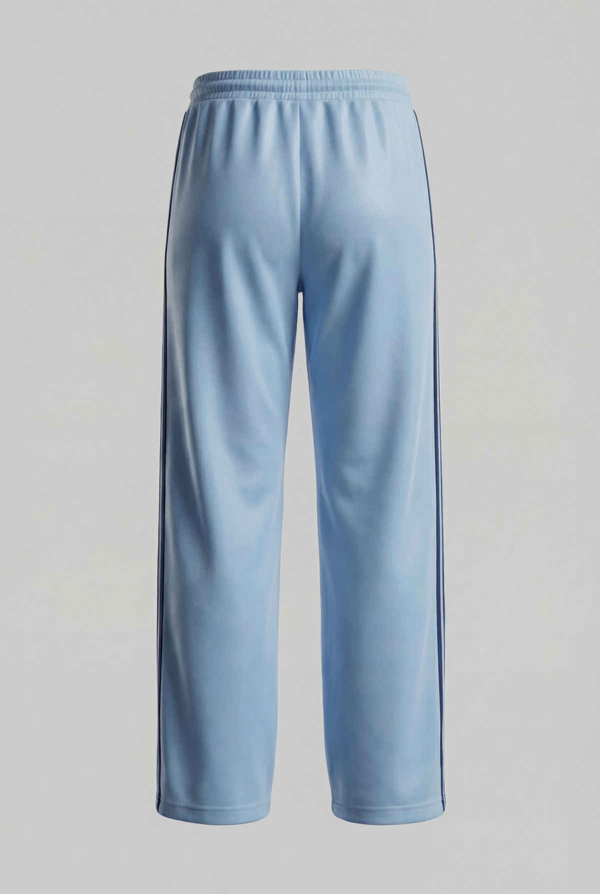 Back view of light blue track pants with navy side stripes.