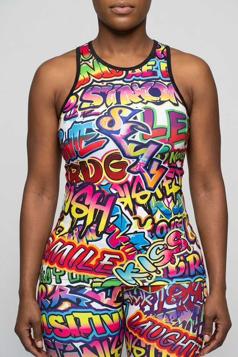 A person wearing the Multi Graffiti Tank Top, made from moisture-wicking polyester spandex and featuring vibrant graffiti-style text and designs, stands against a plain light gray background with only their torso and upper legs visible.