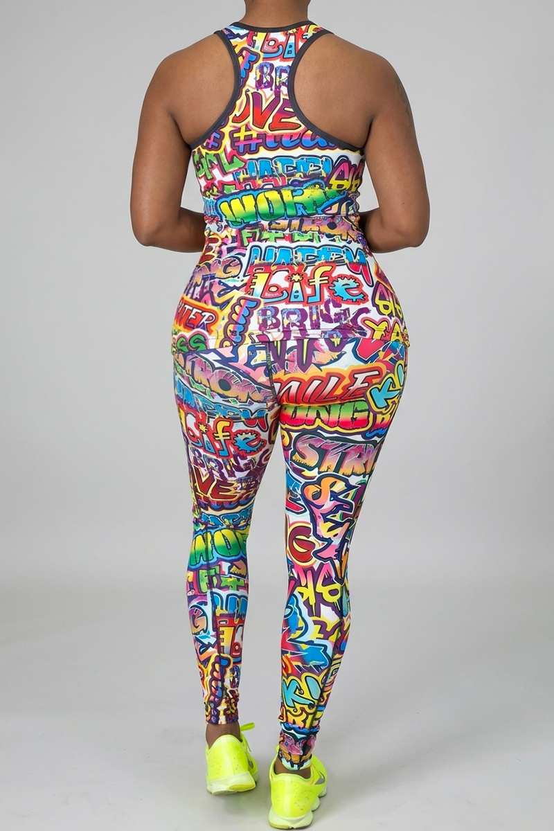 A person faces away from the camera, wearing a colorful Graffiti Tank Top made of polyester spandex with neon yellow athletic shoes, set against a plain light gray background.
