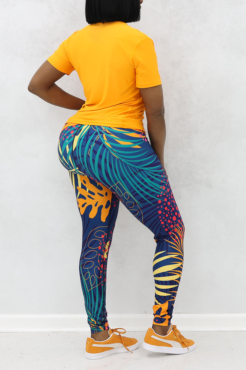 A woman wearing multi-colored Hawaii tights made of stretchy polyester and spandex, featuring a continuous drawstring.