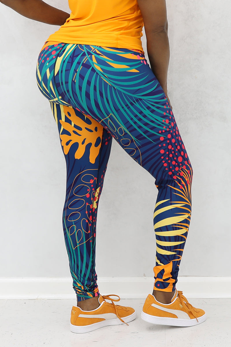 A woman wearing multi-colored Hawaii tights made of stretchy polyester and spandex, featuring a continuous drawstring.