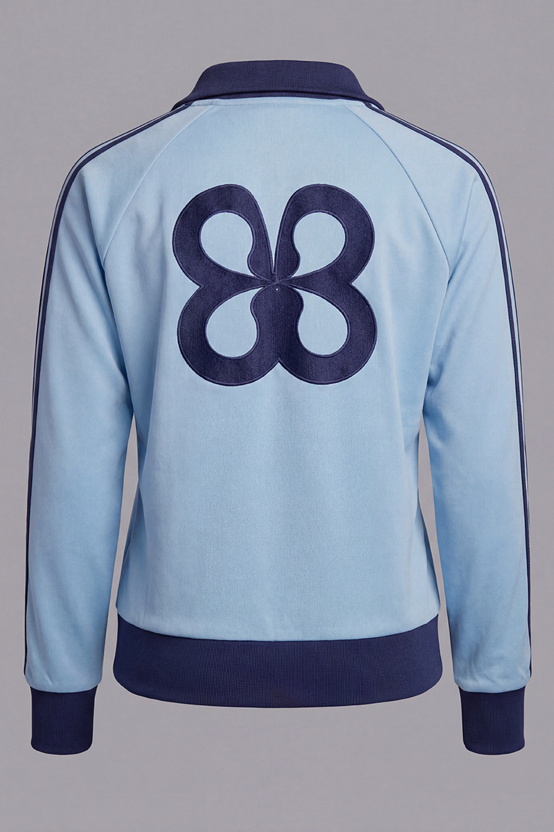 Light blue jacket with a dark blue logo on the back against a gray background