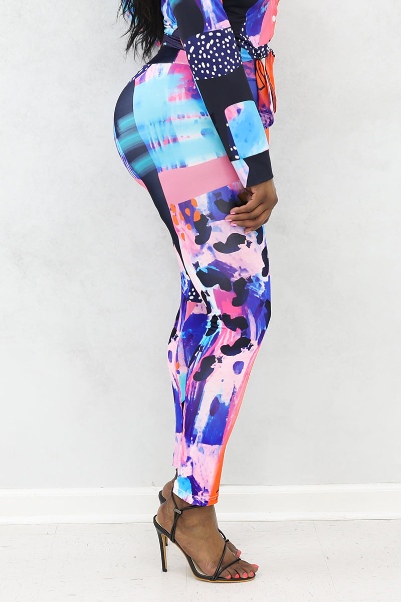 A woman wearing multi-colored Shante Leggings with a stretchy fabric and elastic waistband, perfect for comfort and style during workouts or casual outings.