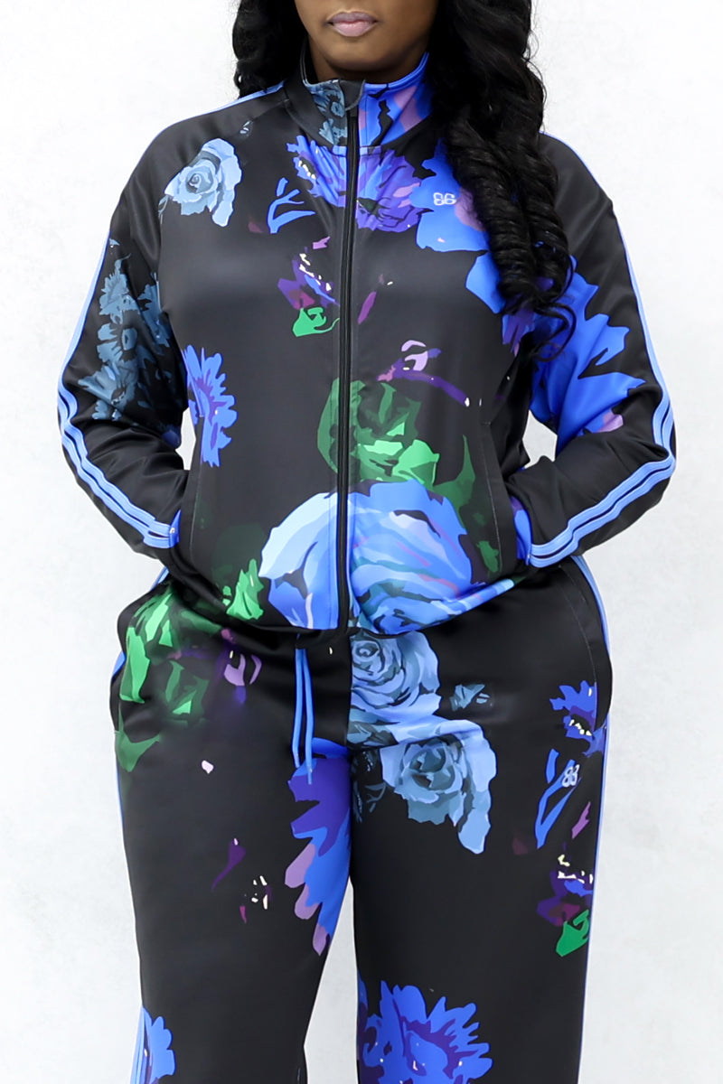 A black jacket with blue roses is shown from the front. The Jacket is stretchy. 