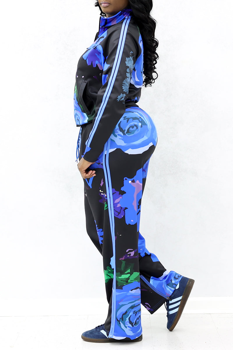 A side-angle view of the black pants with blue roses showcasing the comfortable sweatpants.