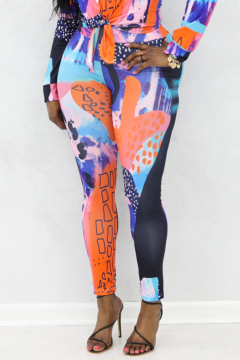 A woman wearing multi-colored Shante Leggings with a stretchy fabric and elastic waistband, perfect for comfort and style during workouts or casual outings.