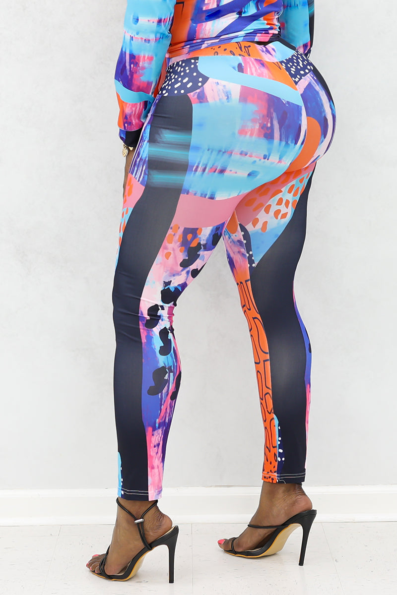 A woman wearing multi-colored Shante Leggings with a stretchy fabric and elastic waistband, perfect for comfort and style during workouts or casual outings.