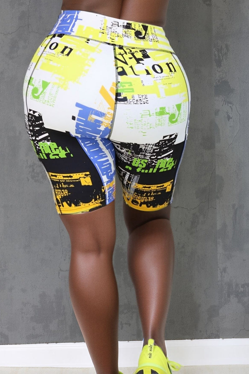 Matching high-waisted shorts with multicolor graphic and text print on white background.