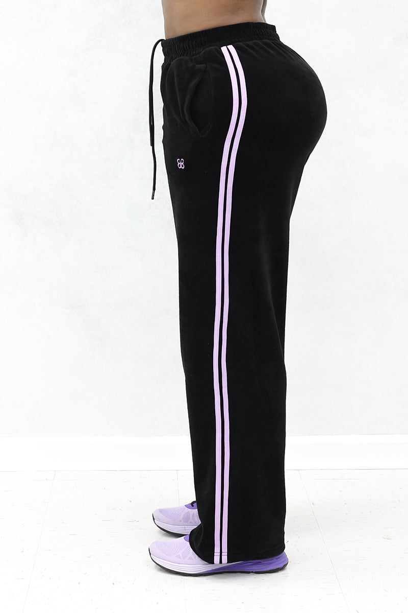 Side view of the Velour Classic Pants, showing the two stripe lines.