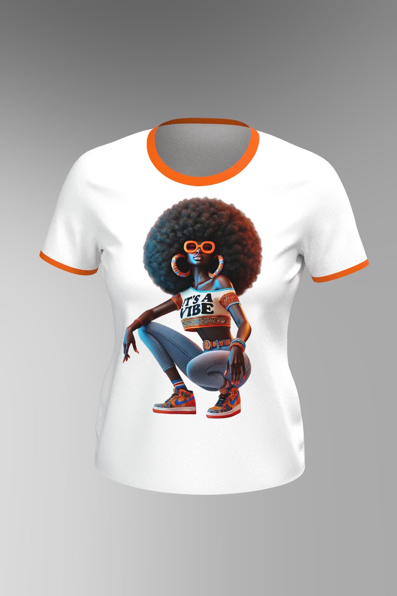 The Vibe Short Sleeve T-Shirt is a white ringer tee with orange trim, featuring an African American woman in vibrant attire, sunglasses, and hoop earrings. Her shirt says ITS A VIBE, making this graphic tee stylish and unique.