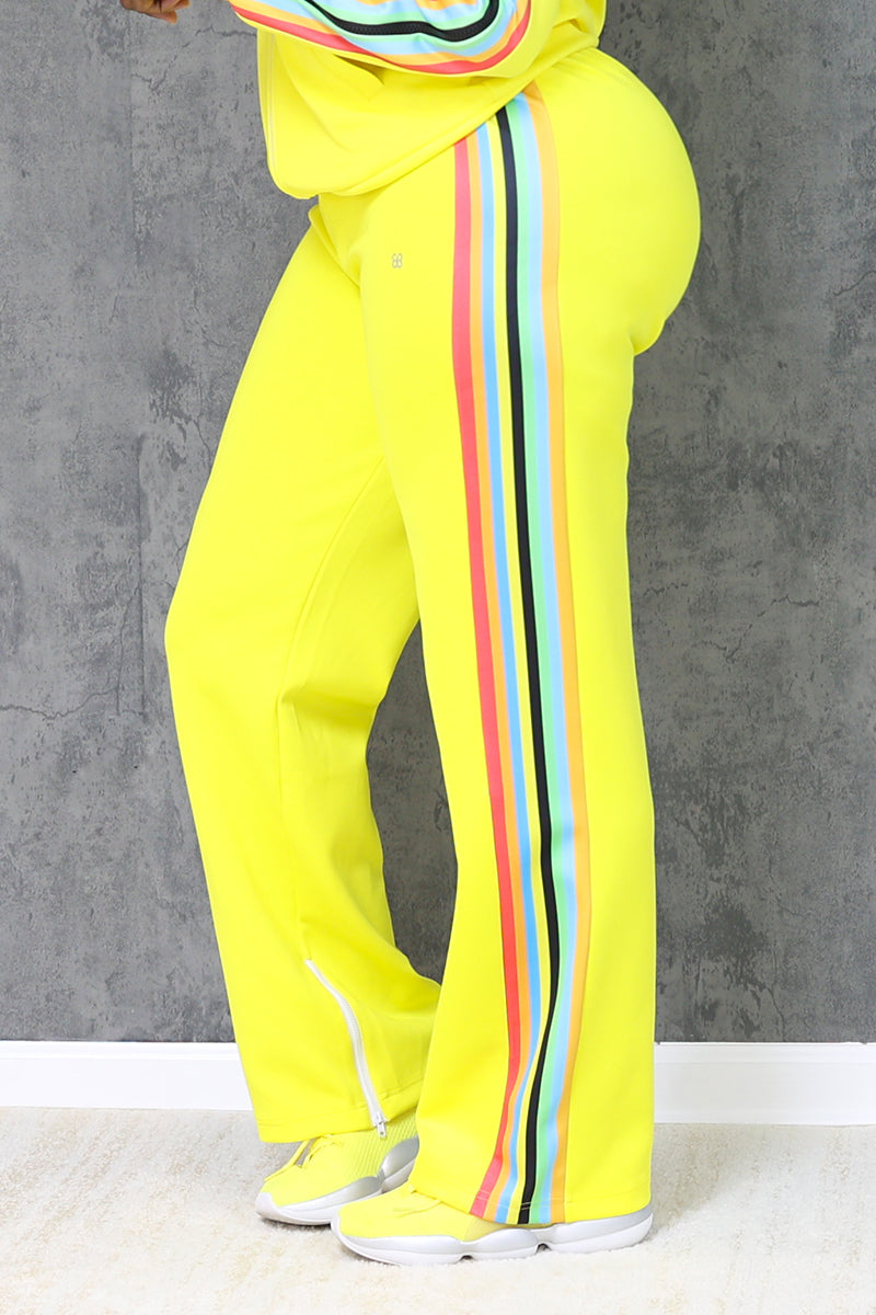 Women's yellow sweatpants with multi colored stripes