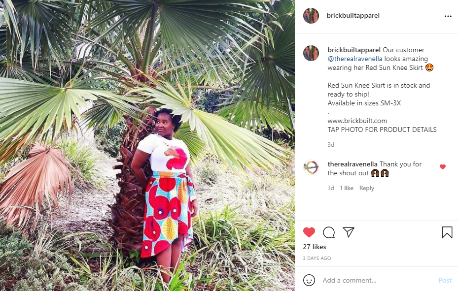 Our customer wearing a Red Sun Knee Skirt featuring a vibrant fishtail design in red and blue, complete with deep pockets and a stylish tie belt, made from high-quality polyester.