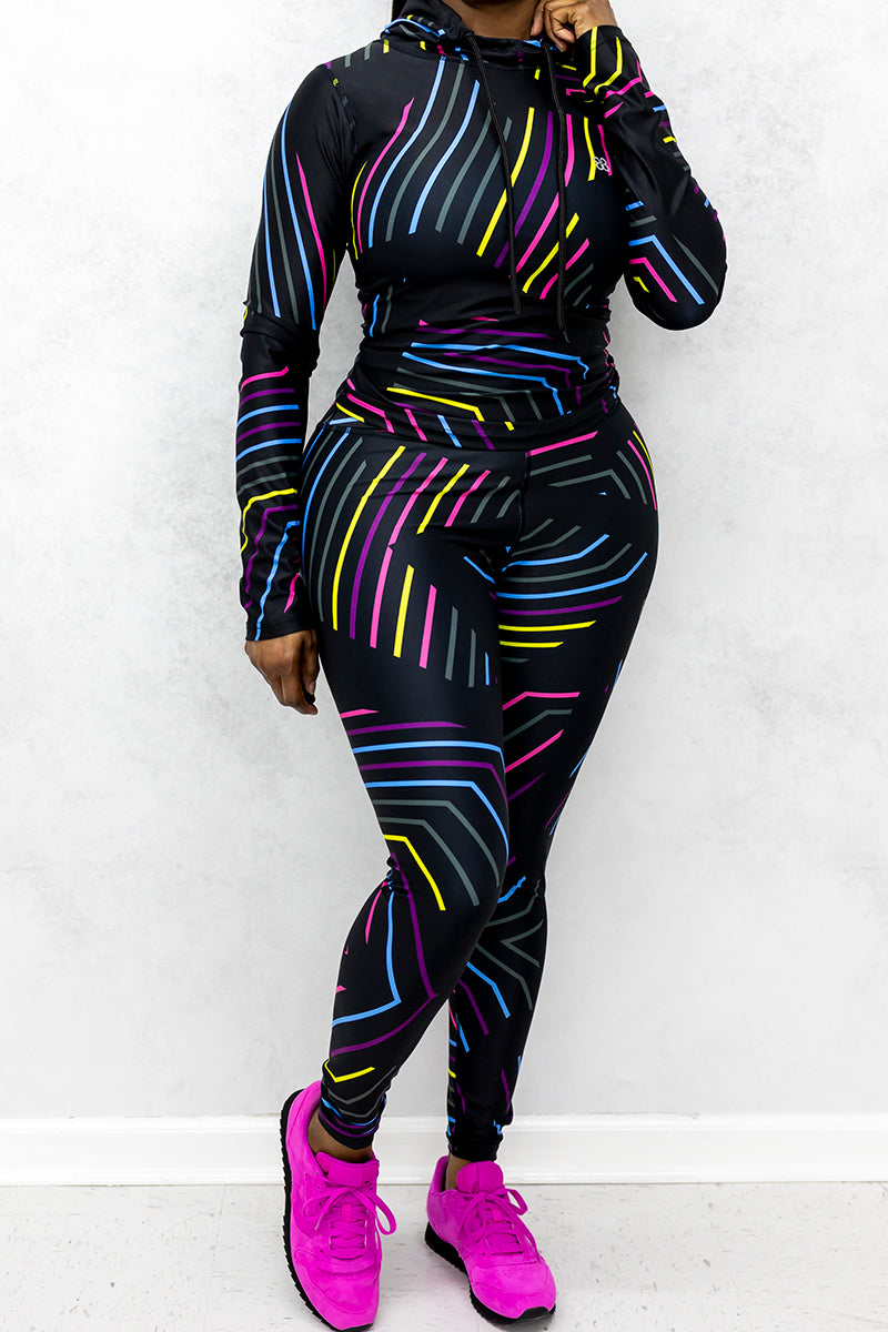 A woman wearing Multi-colored tights featuring a playful candy tights inspired design.